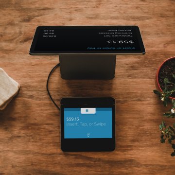 pos system setup on wood countertop